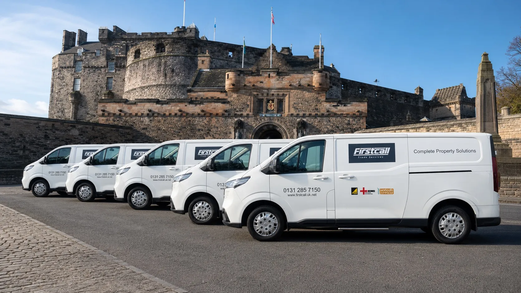 Firstcall Trade Services fleet of vans in front of Edinburgh Castle